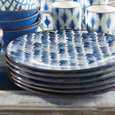 Top view of round indigo blue and white porcelain plate, NAPA Home and Garden